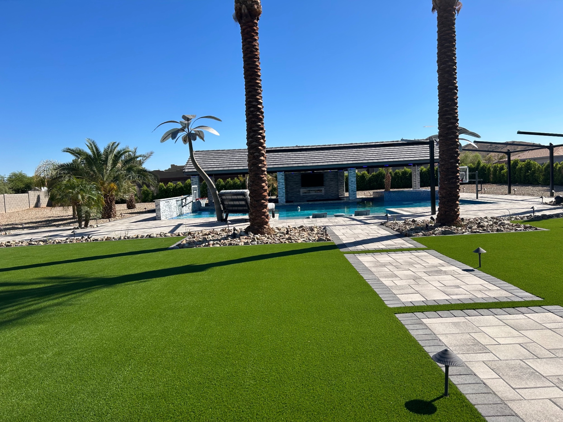 After — Dead lawn → Manicured turf & pavers
