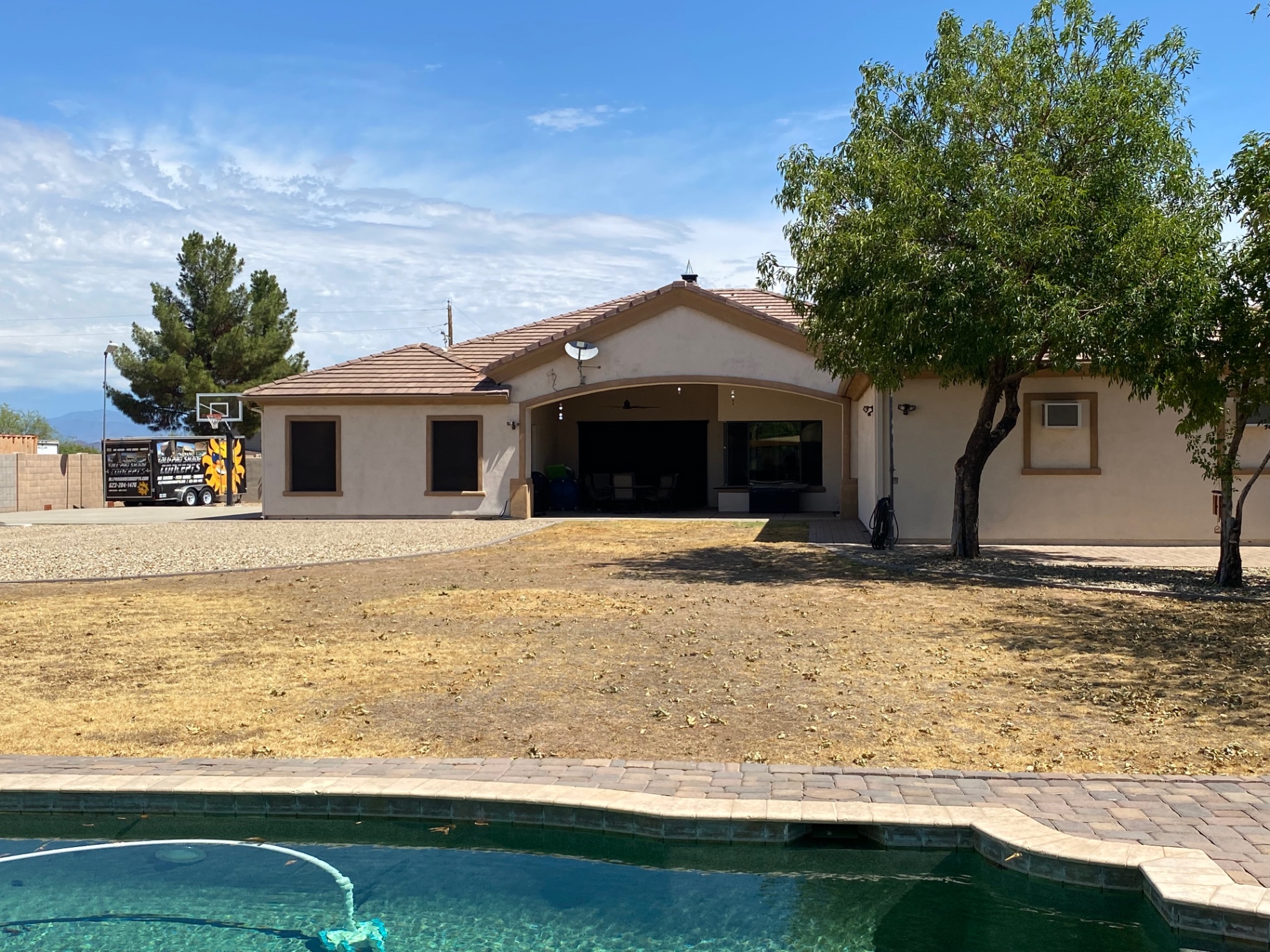 Aurora Estate — back yard before, with dead lawn and tired kidney pool