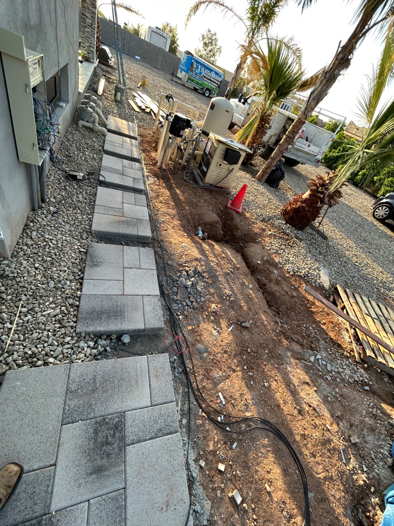 Aurora Estate — side-yard equipment pad with trenched plumbing and electrical runs back to the pool system