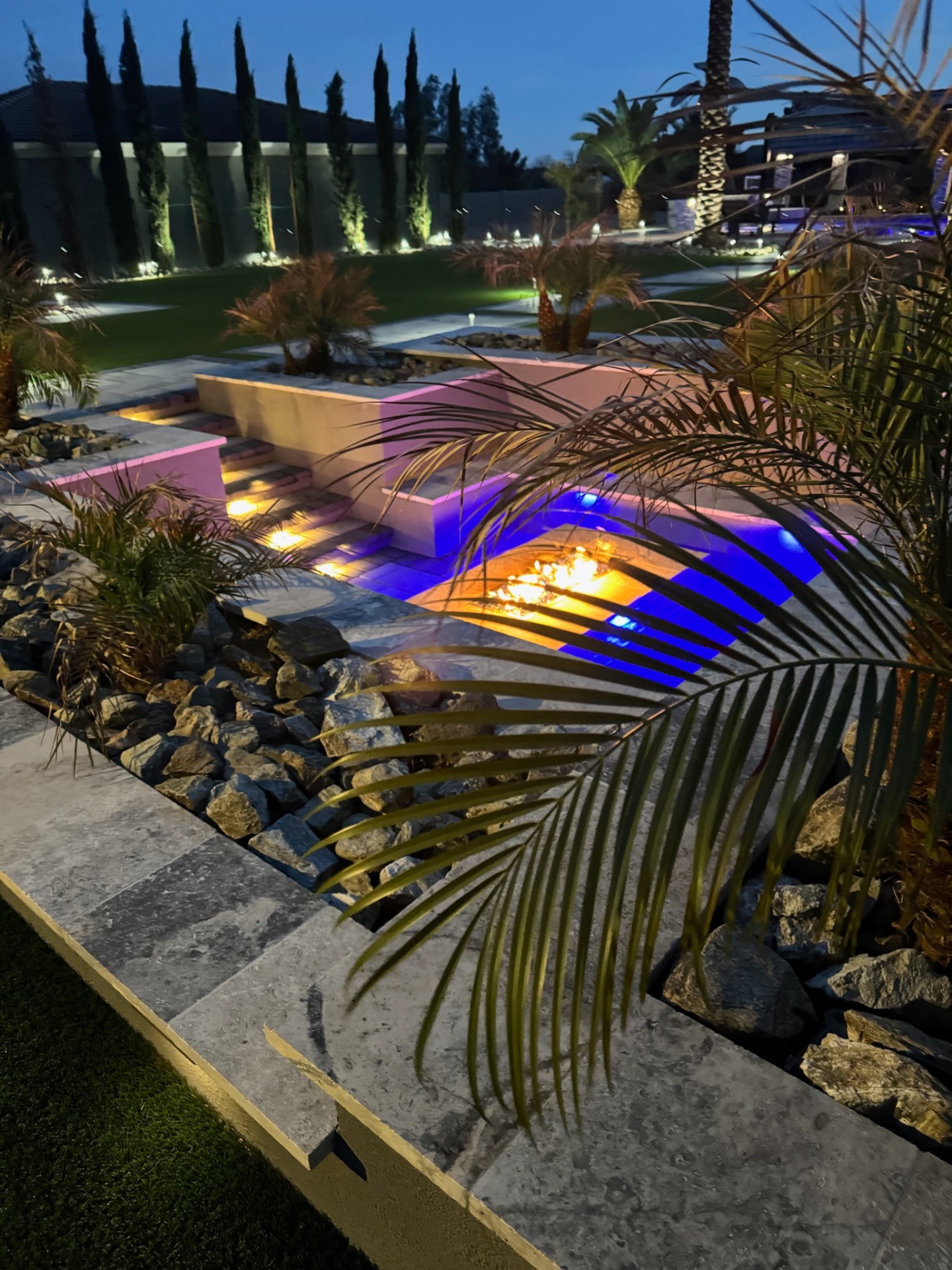 Aurora Estate — sunken fire pit with Italian cypress allée and color-changing landscape lighting