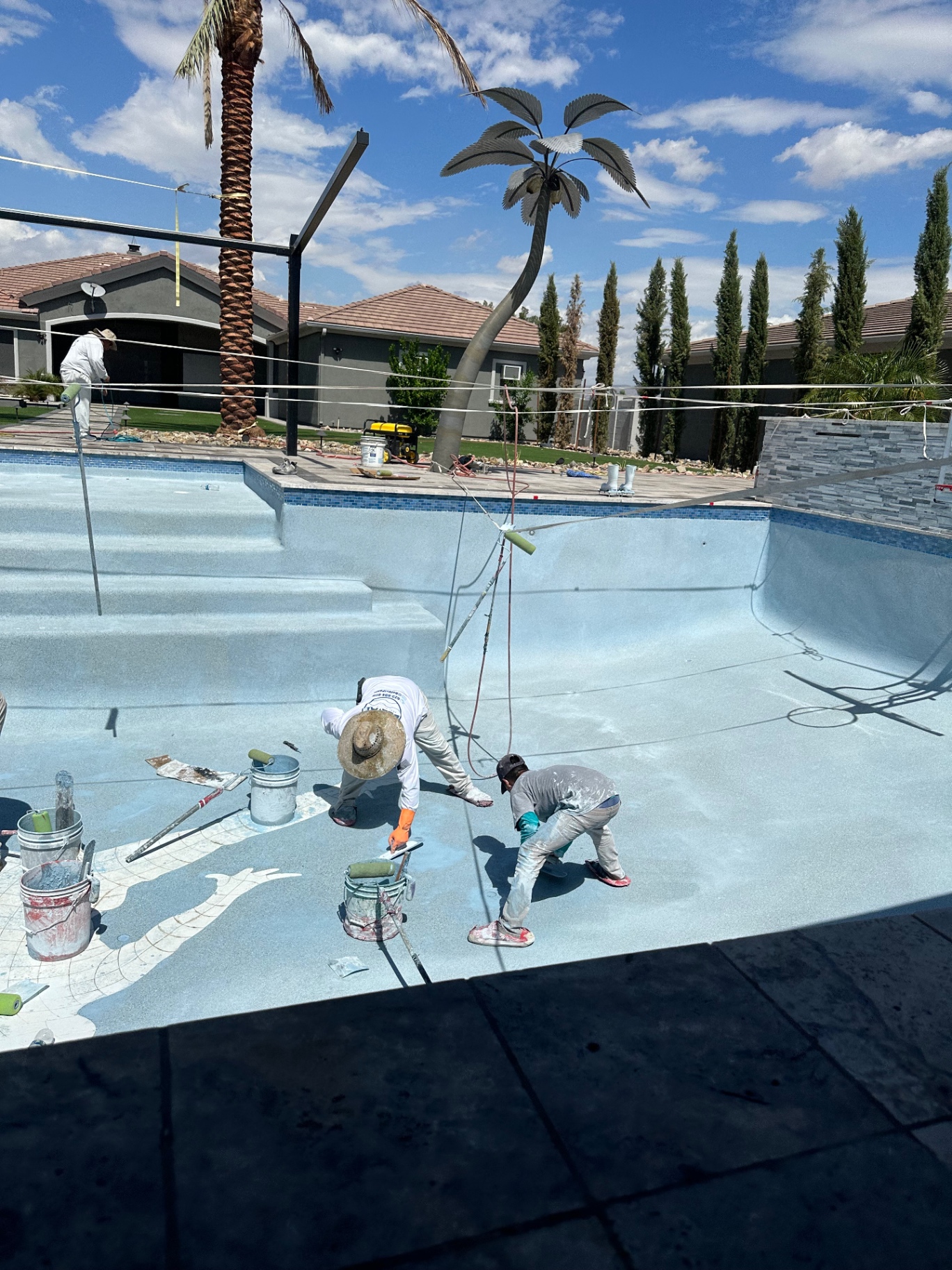 Aurora Estate — wide angle of the Jumpman inlay being rolled out across the deck with the basketball hoop visible behind