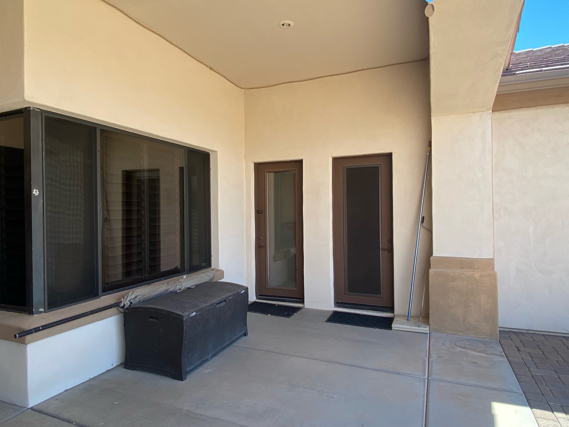 Aurora Estate — bare patio corner before sunken lounge and finishes